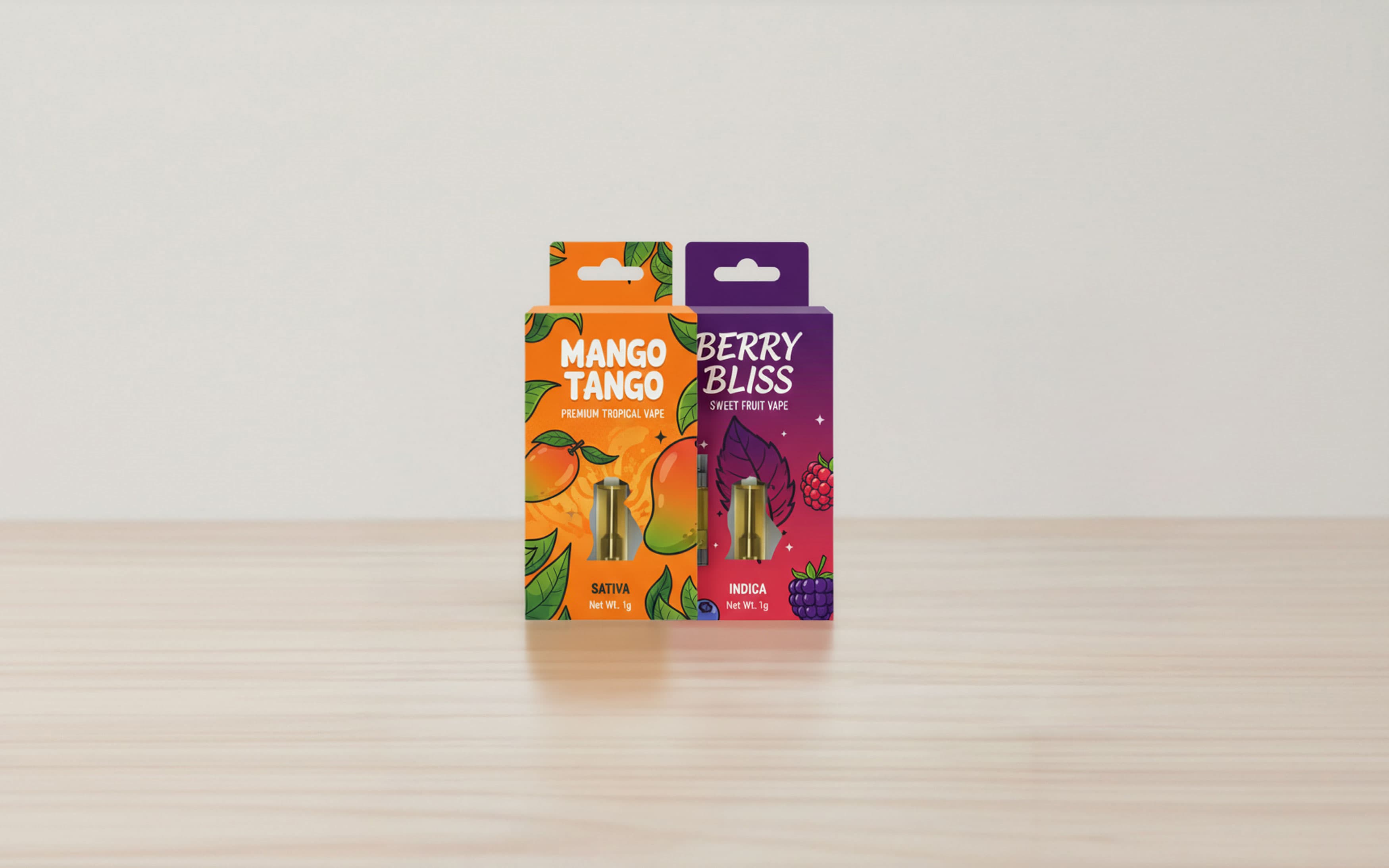 Two colorful vape cartridge boxes side-by-side on a light wooden surface. The left box is bright orange, labeled Mango Tango Premium Tropical Vape. The right box is deep purple, labeled Berry Bliss Sweet Fruit Vape. Both 1g packages have a small window at the bottom showing the gold-colored vape cartridge inside.