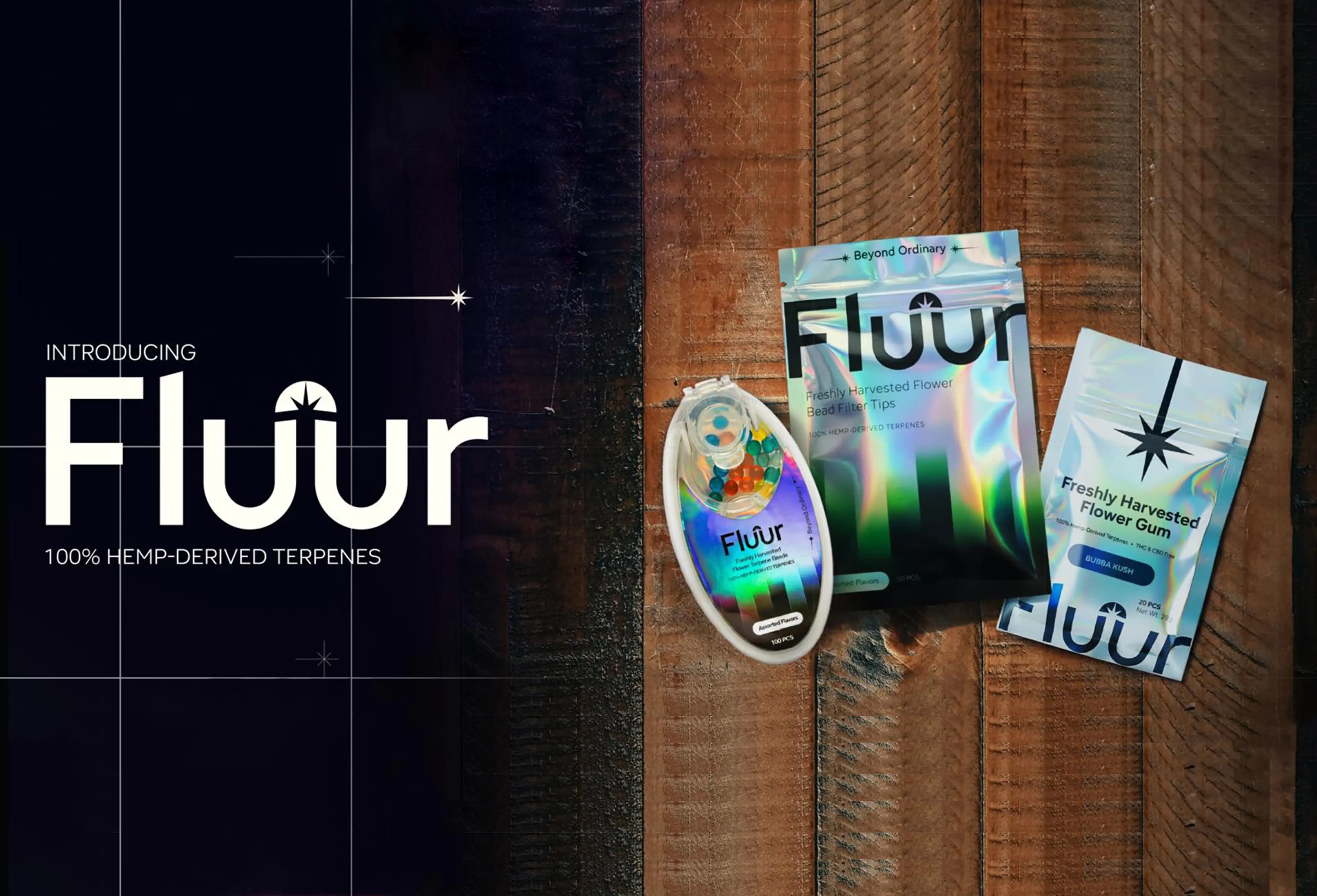 Fluur product lineup featuring hemp-derived terpene beads, filter tips, and flower gum, displayed on a wooden background with modern holographic packaging