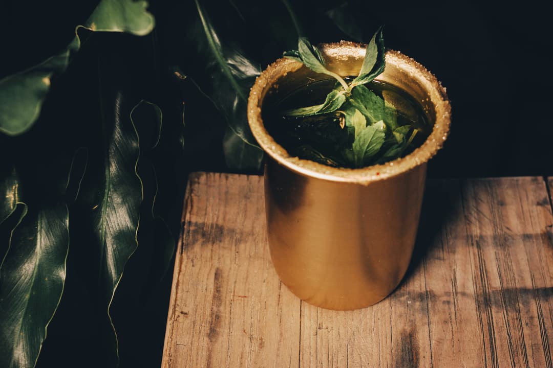 Mint cocktail in a gold cup
